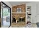 Close up on fireplace and built-in shelving with a view to the deck at 262 Somerset Ct, Lawrenceville, GA 30044