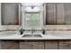 Updated kitchen features new countertops, stainless sink, subway tile backsplash, and stainless dishwasher at 262 Somerset Ct, Lawrenceville, GA 30044
