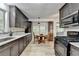 This bright kitchen offers stainless appliances, a breakfast nook, and views to a sunroom at 262 Somerset Ct, Lawrenceville, GA 30044