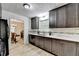 Renovated kitchen showcases stainless steel appliances, and updated countertops and backsplash at 262 Somerset Ct, Lawrenceville, GA 30044
