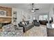 Open-concept living room with brick fireplace, and access to entry and staircase at 262 Somerset Ct, Lawrenceville, GA 30044