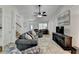 Spacious living room featuring a piano, TV and fireplace with easy access to all parts of the home at 262 Somerset Ct, Lawrenceville, GA 30044