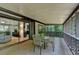 Inviting screened-in patio with a dining set and sliding glass doors leading inside at 262 Somerset Ct, Lawrenceville, GA 30044