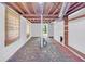 Unfinished basement with exposed wood ceiling and painted walls, ready for customization at 2773 Fairlane Dr, Atlanta, GA 30354