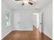 Bedroom with hardwood floors, white walls, a ceiling fan, and natural light from the window at 2773 Fairlane Dr, Atlanta, GA 30354