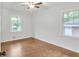 Bright bedroom features hardwood floors, a ceiling fan, natural light, and ample space at 2773 Fairlane Dr, Atlanta, GA 30354