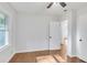 Bedroom featuring hardwood floors, white walls, a ceiling fan, and natural light at 2773 Fairlane Dr, Atlanta, GA 30354