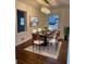 Well lit Dining room with hardwood floors, view of yard, and stylish light fixture at 2773 Fairlane Dr, Atlanta, GA 30354