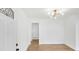 Bright foyer featuring fresh paint, attractive light fixture, and beautiful hardwood flooring at 2773 Fairlane Dr, Atlanta, GA 30354