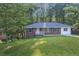 Charming brick home with a well-manicured lawn and mature trees, offering a peaceful and inviting curb appeal at 2773 Fairlane Dr, Atlanta, GA 30354