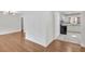 Open-concept living room and kitchen area with hardwood floors and white cabinetry at 2773 Fairlane Dr, Atlanta, GA 30354