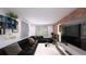 Modern living room with brick accent wall, large tv, stylish decor and window views at 2773 Fairlane Dr, Atlanta, GA 30354