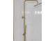 Close-up of a bathroom shower featuring marble tile and gold hardware at 2773 Fairlane Dr, Atlanta, GA 30354