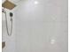 Close-up of a shower showcasing marble-patterned tile walls and a modern rainfall shower head at 2773 Fairlane Dr, Atlanta, GA 30354