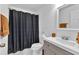 Bathroom featuring a shower with curtain, vanity, and a modern toilet at 2912 Palm Dr, East Point, GA 30344