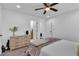 Bright bedroom with a ceiling fan, dresser, and a glimpse into the bathroom at 2912 Palm Dr, East Point, GA 30344