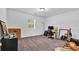 Carpeted bedroom with a window and a desk space perfect for study or work at 2912 Palm Dr, East Point, GA 30344