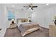 Carpeted bedroom featuring a queen bed, nightstands and modern ceiling fan at 2912 Palm Dr, East Point, GA 30344