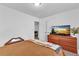 Bedroom with carpet flooring and a wooden dresser with a TV on it at 2912 Palm Dr, East Point, GA 30344