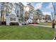 A charming home with a lush green lawn and trees, perfect for enjoying the outdoors at 2912 Palm Dr, East Point, GA 30344