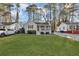 Charming home featuring a well-maintained front yard, a covered porch, and beautiful landscaping at 2912 Palm Dr, East Point, GA 30344