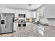 Bright kitchen features stainless steel appliances, granite countertops, and modern white cabinetry at 2912 Palm Dr, East Point, GA 30344