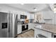 Modern kitchen featuring stainless steel appliances, granite countertops, and white subway tile backsplash at 2912 Palm Dr, East Point, GA 30344