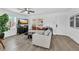 Bright living room with natural light, stylish decor, and hardwood floors, perfect for modern living at 2912 Palm Dr, East Point, GA 30344