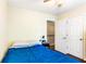 Bedroom with hardwood floors has a view to the staircase and an adjacent closet at 404 Summerchase Way, Woodstock, GA 30189