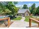 Charming clubhouse with stone accents and lush landscaping creates a welcoming community entrance at 404 Summerchase Way, Woodstock, GA 30189