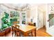 Bright dining room with wood table, view of backyard, and natural light at 404 Summerchase Way, Woodstock, GA 30189