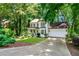 Charming two-story home featuring a two-car garage and lush green surroundings at 404 Summerchase Way, Woodstock, GA 30189