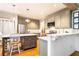 Bright eat-in kitchen featuring stainless appliances, ample counter space, and hardwood floors at 404 Summerchase Way, Woodstock, GA 30189