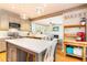 Bright kitchen with stainless appliances, white countertops, grey cabinets and hardwood floors at 404 Summerchase Way, Woodstock, GA 30189