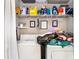Functional laundry area with shelving, providing ample storage and organization in a compact space at 404 Summerchase Way, Woodstock, GA 30189