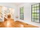 Open floor plan showcasing hardwood floors and abundant natural light from the window at 404 Summerchase Way, Woodstock, GA 30189