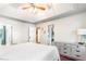 Spacious main bedroom with trey ceiling, hard wood floors, and sightlines into the ensuite bathroom at 404 Summerchase Way, Woodstock, GA 30189