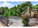 Inviting pool area with lounge seating and lush greenery, perfect for enjoying sunny days at 404 Summerchase Way, Woodstock, GA 30189