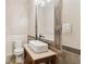 Modern bathroom featuring a vessel sink, decorative mirror, and tiled accents at 5172 Roswell Rd, Marietta, GA 30062