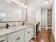 Bright bathroom with a granite countertop double sink vanity and white cabinets at 5172 Roswell Rd, Marietta, GA 30062