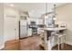 Kitchen with pendant lights, a granite bar, and white cabinets at 5172 Roswell Rd, Marietta, GA 30062