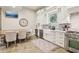 Bright kitchen featuring stainless steel appliances, stone floors and a dining area at 5172 Roswell Rd, Marietta, GA 30062
