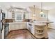 This eat-in kitchen features stainless steel appliances, white cabinets, and a granite countertop at 5172 Roswell Rd, Marietta, GA 30062