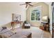 Well-lit living room featuring a high ceiling, a large window and seating area at 5172 Roswell Rd, Marietta, GA 30062