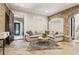 Cozy living room featuring stone floors, exposed brick, and a comfortable seating area at 5172 Roswell Rd, Marietta, GA 30062