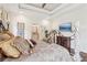 This main bedroom includes white walls, hardwood floors, and a large wrought iron bed at 5172 Roswell Rd, Marietta, GA 30062