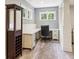 Home office with a built-in desk, white cabinets, and a comfortable chair at 5172 Roswell Rd, Marietta, GA 30062