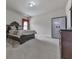 Cozy bedroom with carpet, dark wooden furniture and a window with blinds and curtains at 1510 Silver Mist Cir, Powder Springs, GA 30127