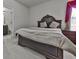 Comfortable bedroom featuring an ensuite bathroom with a large bed at 1510 Silver Mist Cir, Powder Springs, GA 30127