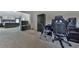 View of bedroom shows bed, entertainment center and desk with gaming equipment at 1510 Silver Mist Cir, Powder Springs, GA 30127
